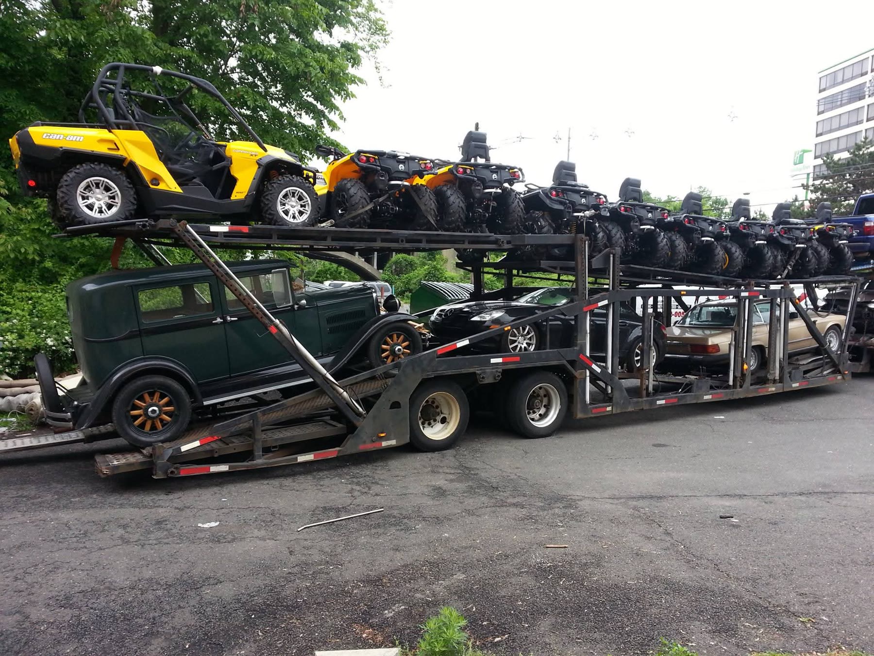 Vehicles and ATVs prepared for international transport on a car carrier