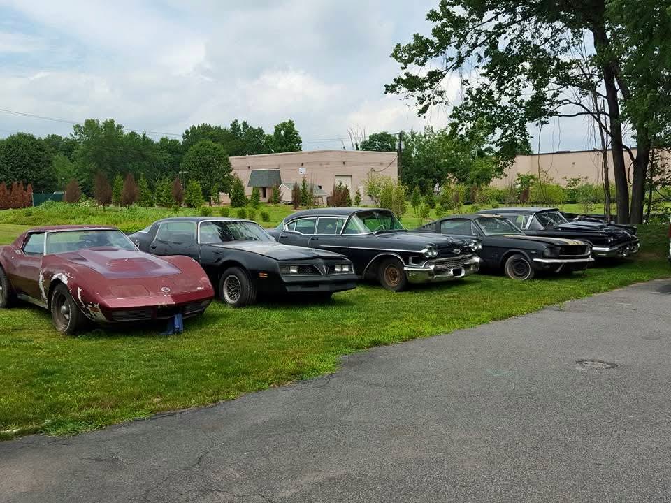 Lineup of American collector cars awaiting transport review