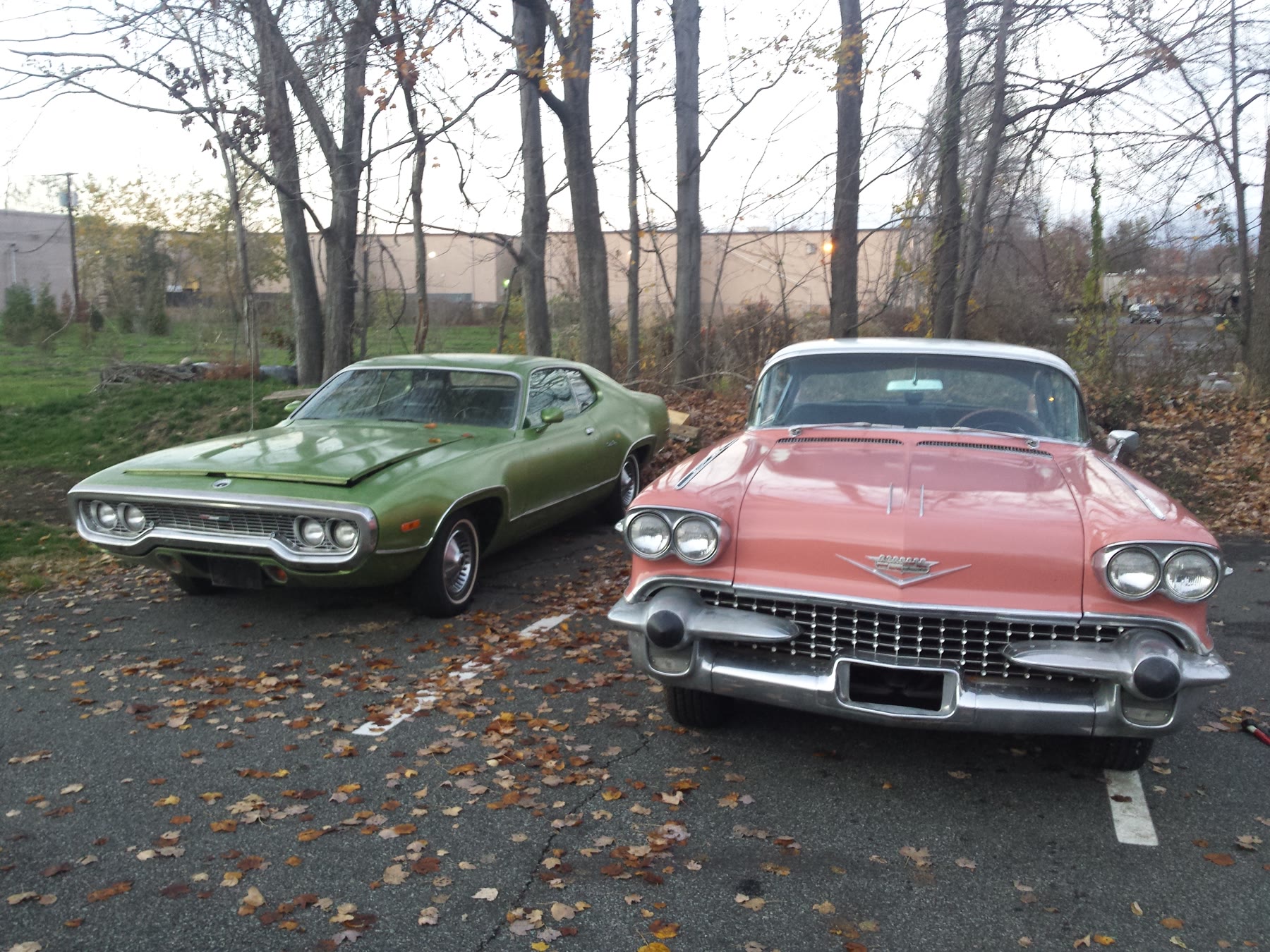 Two classic American cars awaiting transport