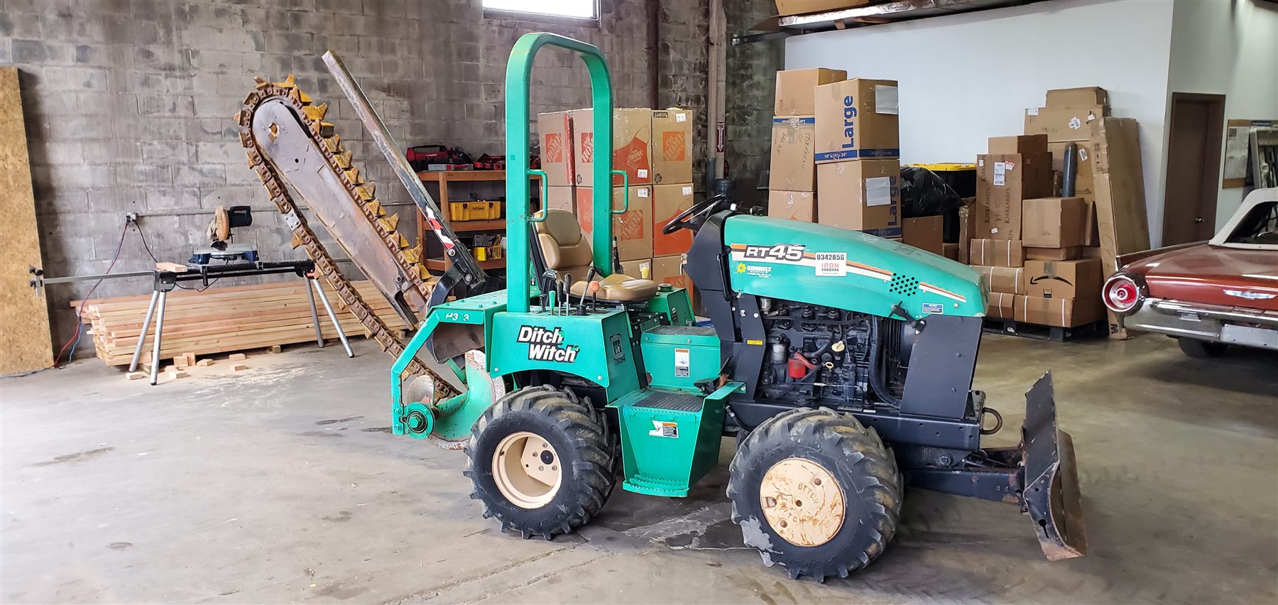 Heavy equipment, a vehicle, and boxed cargo inside a US warehouse