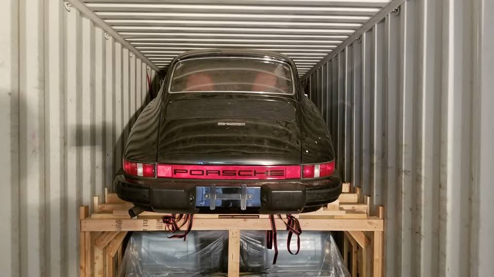 Porsche secured inside a shipping container